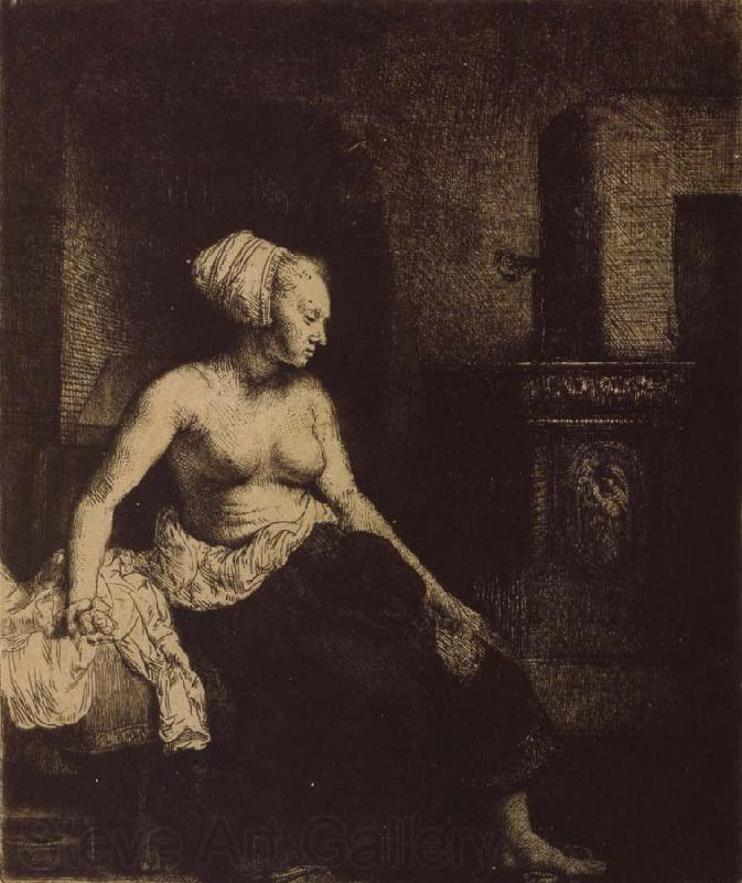 REMBRANDT Harmenszoon van Rijn Woman sitting Half-Dressed beside a Stove